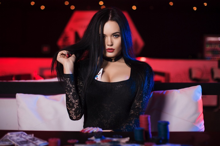 Woman with playing cards in a casino