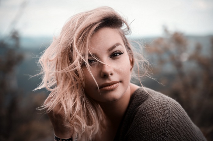 Woman with blonde hair outdoors