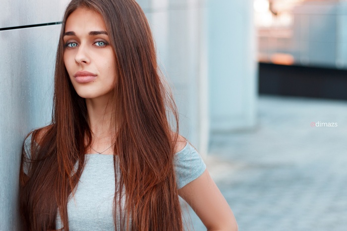 Woman with long brown hair and blue eyes