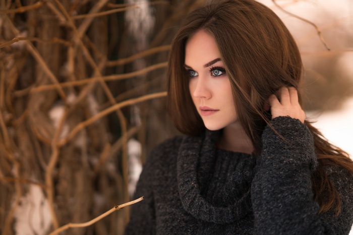 Woman in a sweater looking away