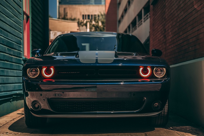 Blue Dodge Challenger with racing stripes