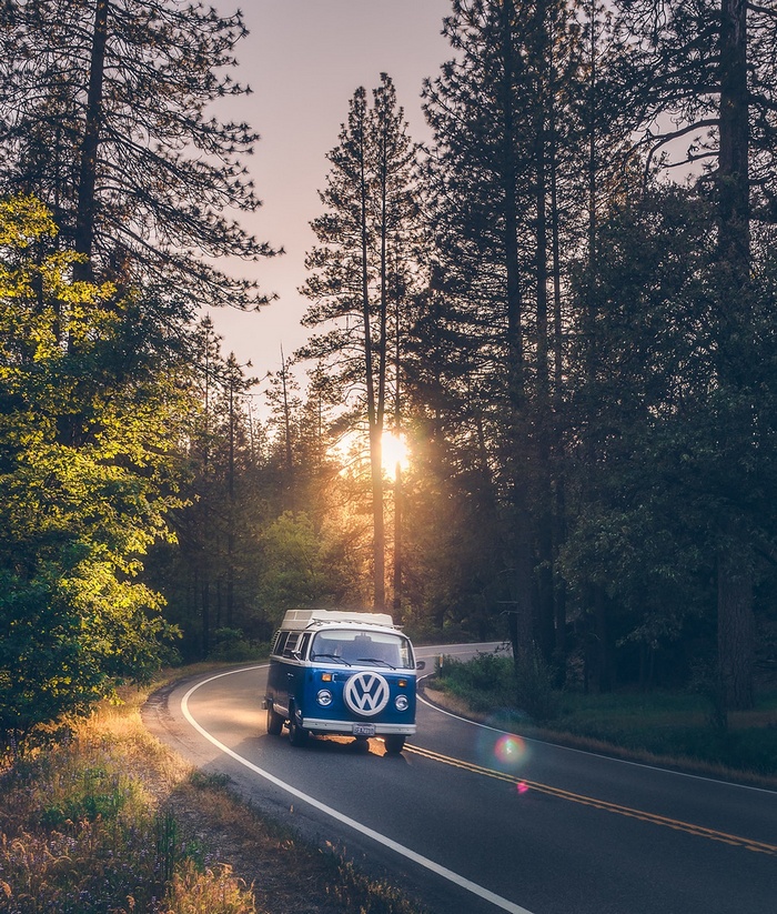 Blue VW Bus driving on a road in Yosemite National Park