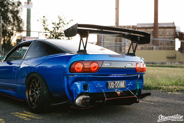 Blue Nissan 180SX with large rear spoiler