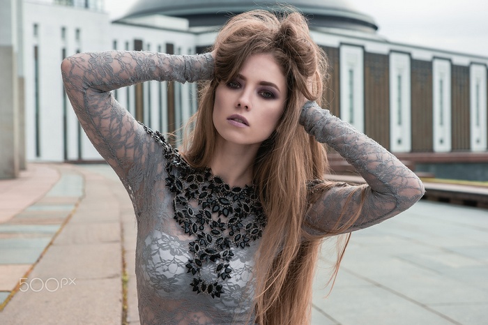 Woman with long hair and see-through clothing