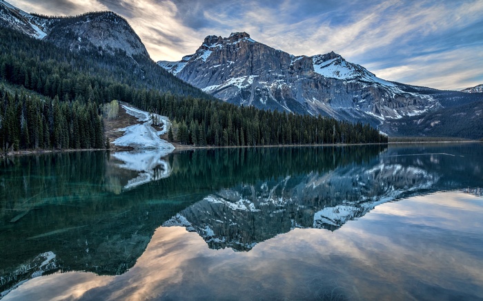 Mountain lake with forest reflection
