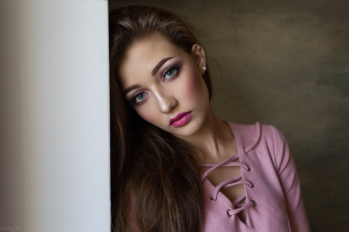 Woman with pink makeup and pink top