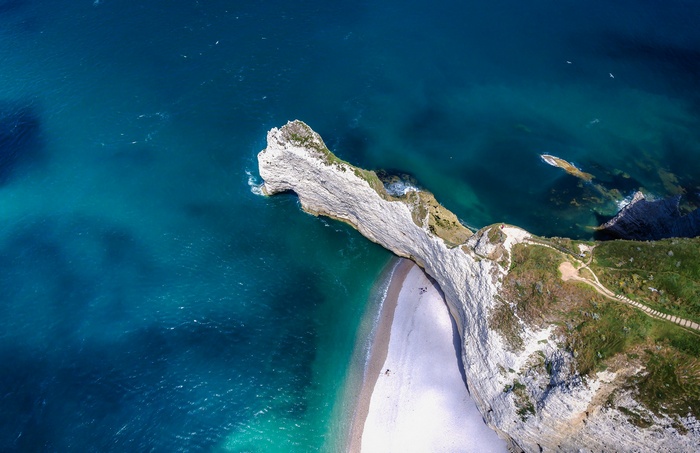 Aerial view of white cliffs and turquoise ocean