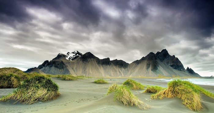 Mountain range with sand dunes and grass