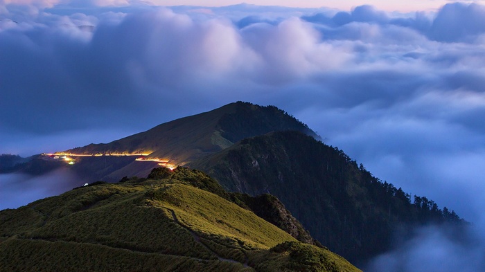 Mountain road with clouds at dusk