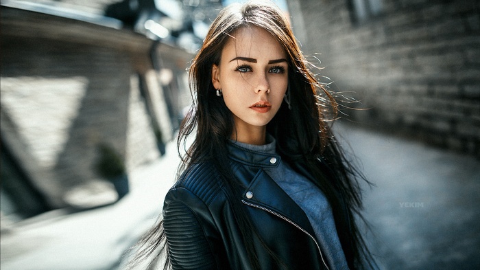 Woman in leather jacket outdoors