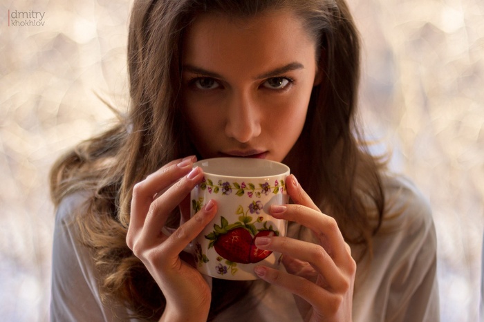 Woman holding a strawberry mug