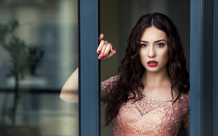 Woman with red lipstick and nails