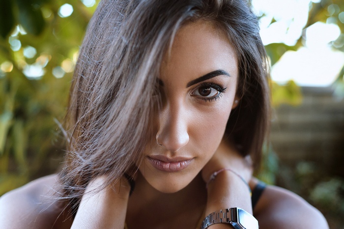 Woman with nose ring and watch