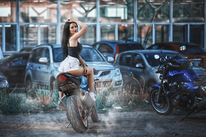 tanned, long hair, women with motorcycles, sneakers, ass, red lipstick, jean shorts, sitting, motorcycle, car, red nails, women