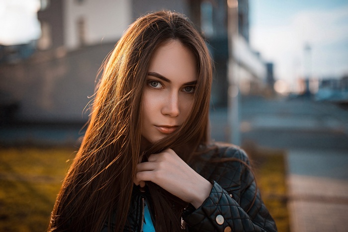 Woman in leather jacket outdoors