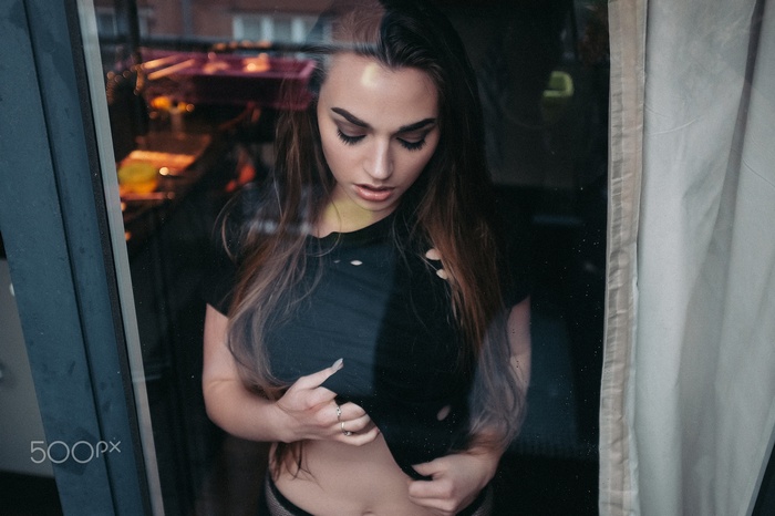 Woman looking down through glass