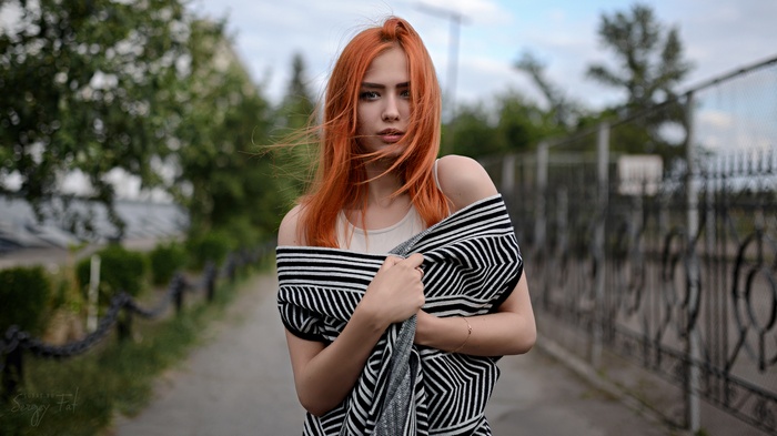 Redhead woman with striped shawl outdoors