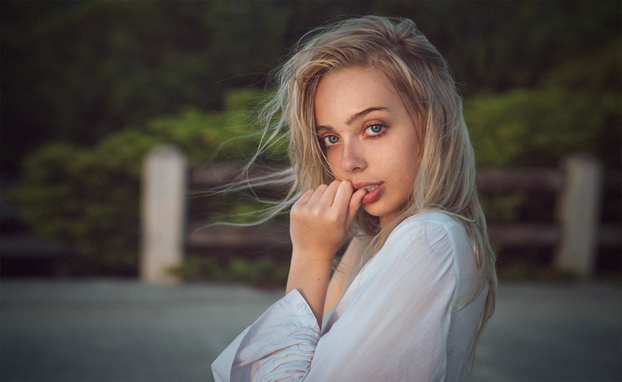 Woman with blonde hair outdoors