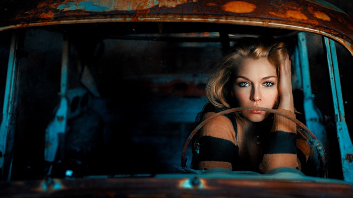 Model in a rusty car