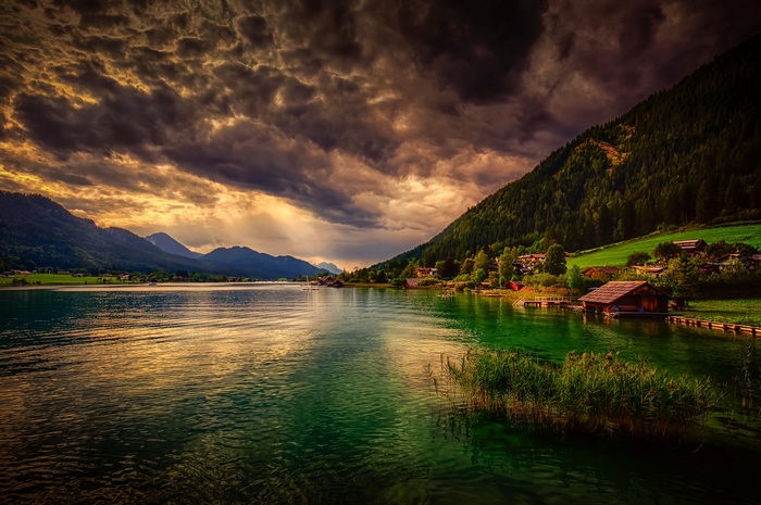 Lake and mountains with dramatic clouds