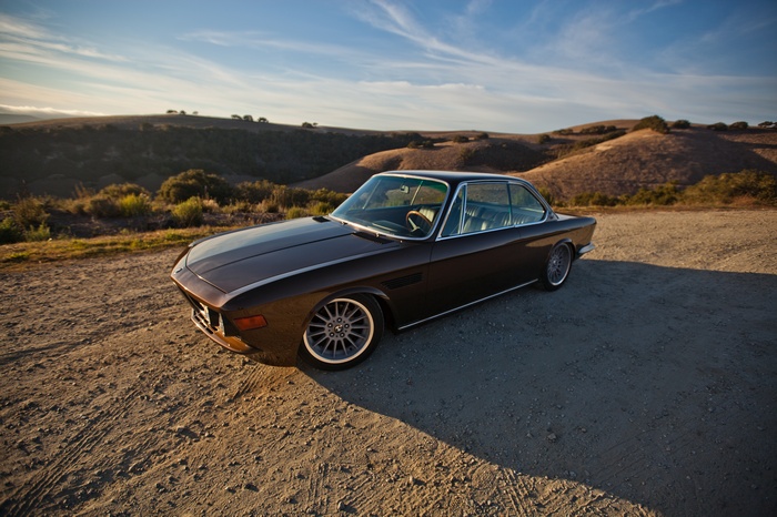 Brown BMW E29 Coupe on a Dirt Road