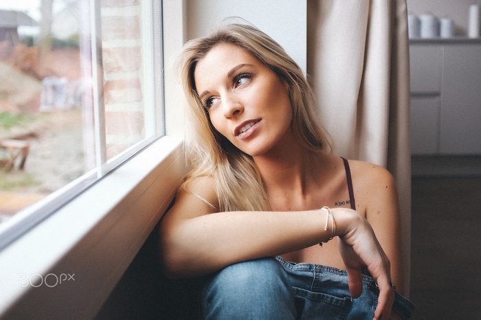 Woman sitting by the window