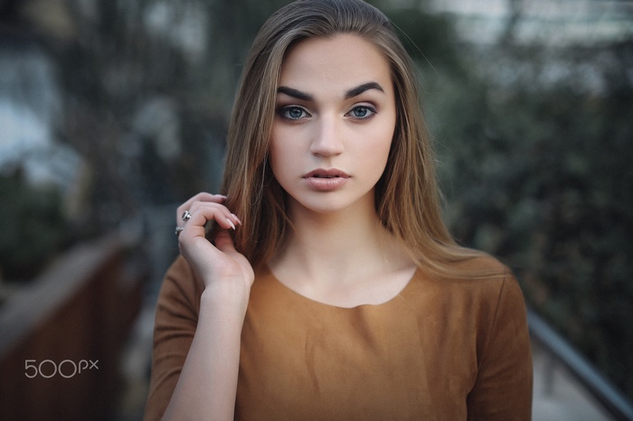 Portrait of a young woman with blue eyes