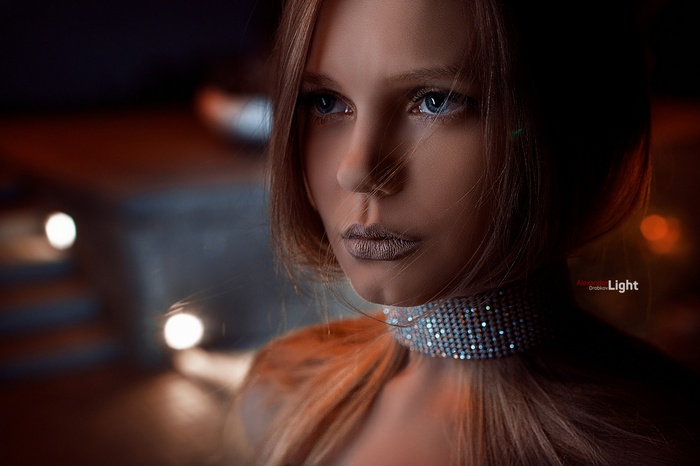 Portrait of a woman with blue eyes and a jeweled collar