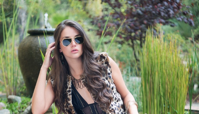 Allie Haze wearing sunglasses and a leopard print vest