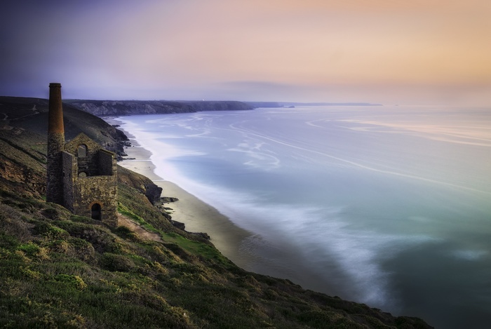 Ruined mine building on a cliff overlooking the sea in Cornwall