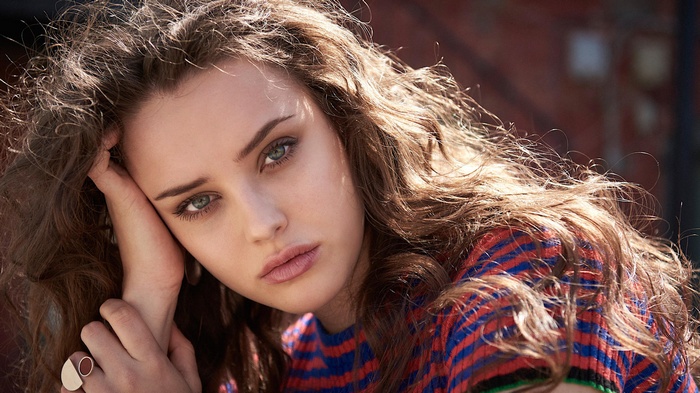 Katherine Langford with curly brown hair