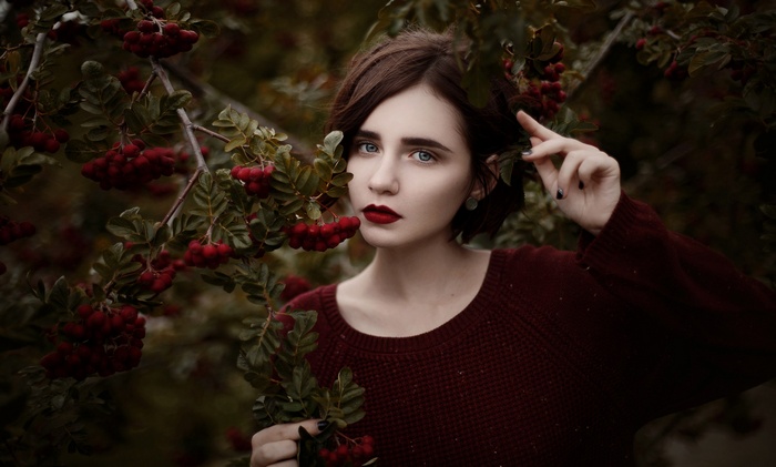 Woman with red lipstick and berries