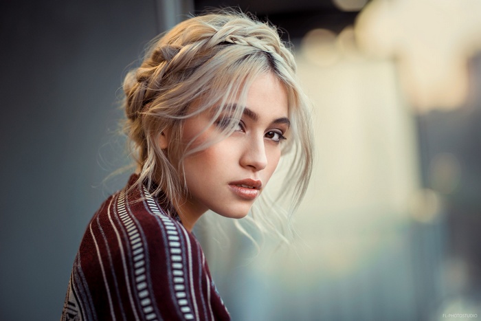 Portrait of a woman with braided blonde hair