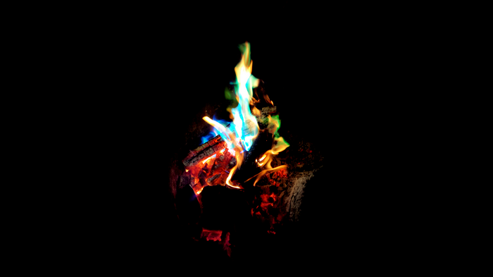 Colorful fire burning in the dark