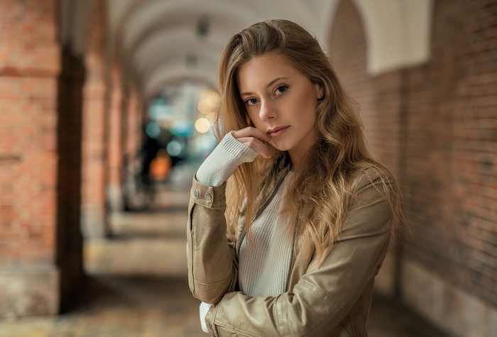 Woman in leather jacket looking at viewer
