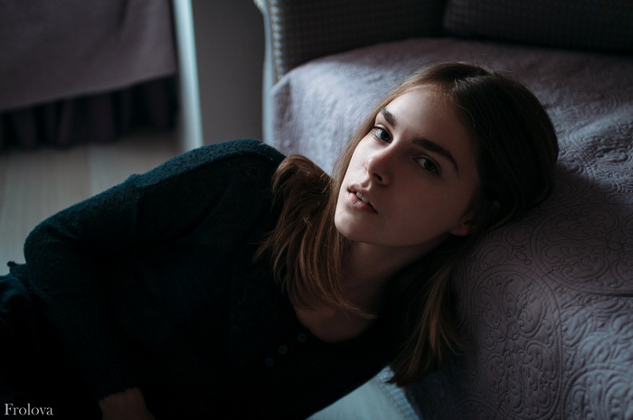 Yana Frolova lying on a bed