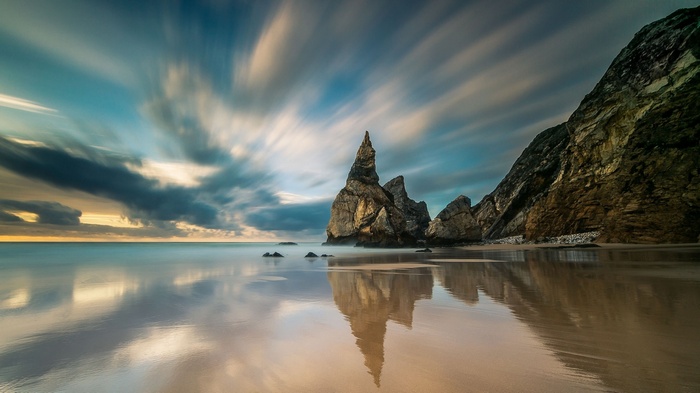 Long exposure of rock formations on a beach in Portugal