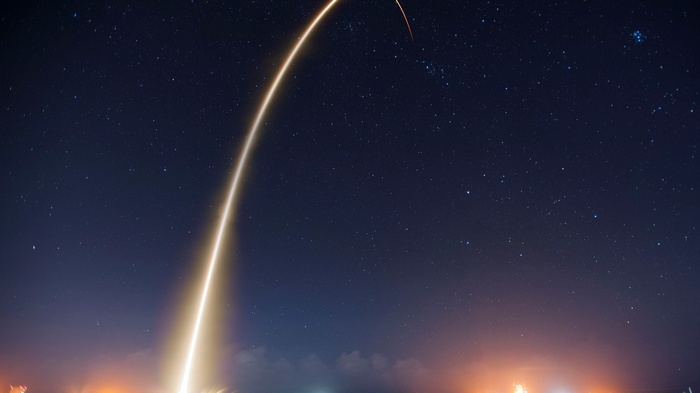 Rocket Launching into Starry Night Sky