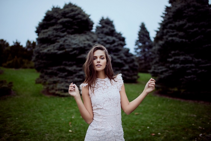 Woman in white dress in a park