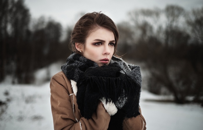 Woman in scarf and jacket in winter