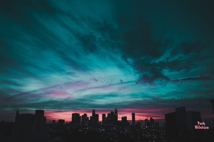 Cityscape at Dusk with Colorful Clouds