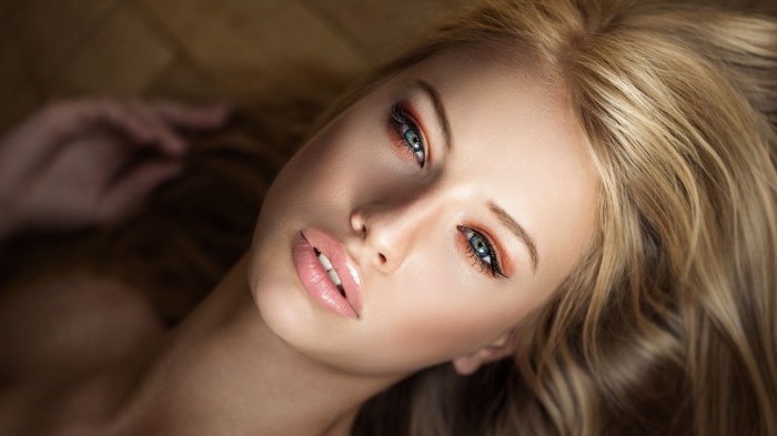 Portrait of a blonde woman with makeup