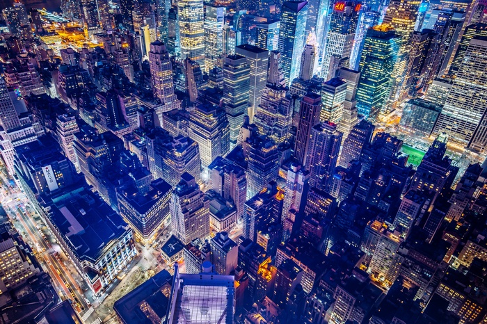 New York City skyline at night with bright lights