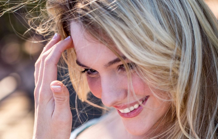 Woman with blonde hair smiling