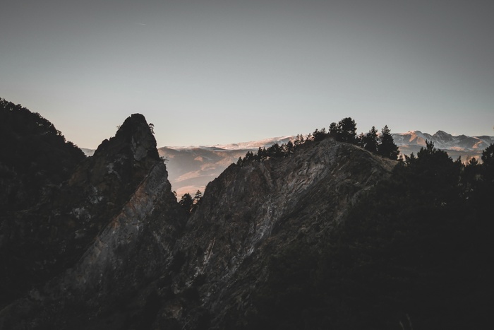 Mountains landscape with trees and sky