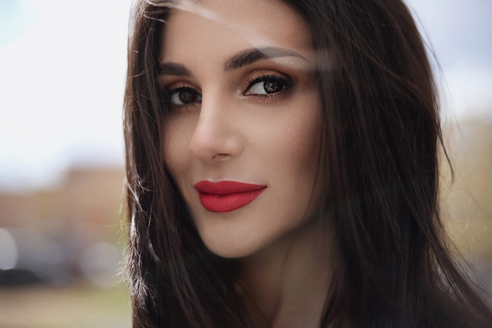 Woman with red lipstick and dark hair