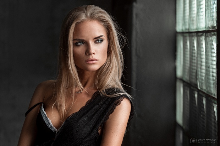 Woman with blonde hair looking away