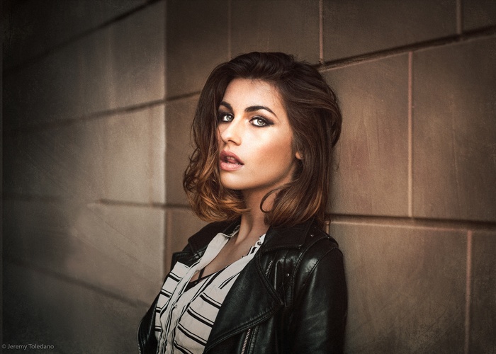 Woman with smoky eyes and leather jacket