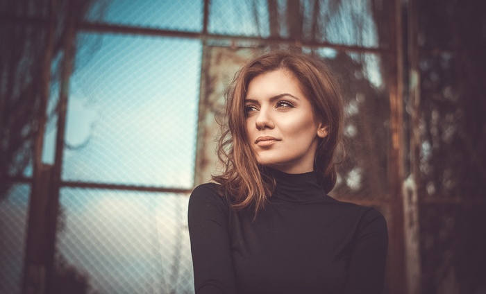 Woman in turtleneck looking away outdoors