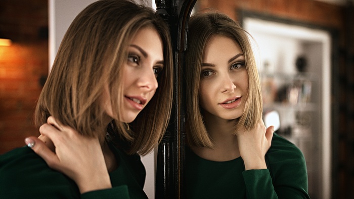 Woman looking in a mirror